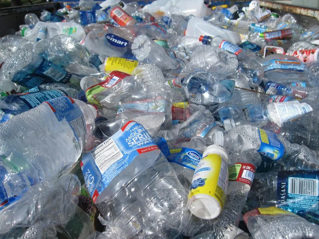 a collection of empty water bottles